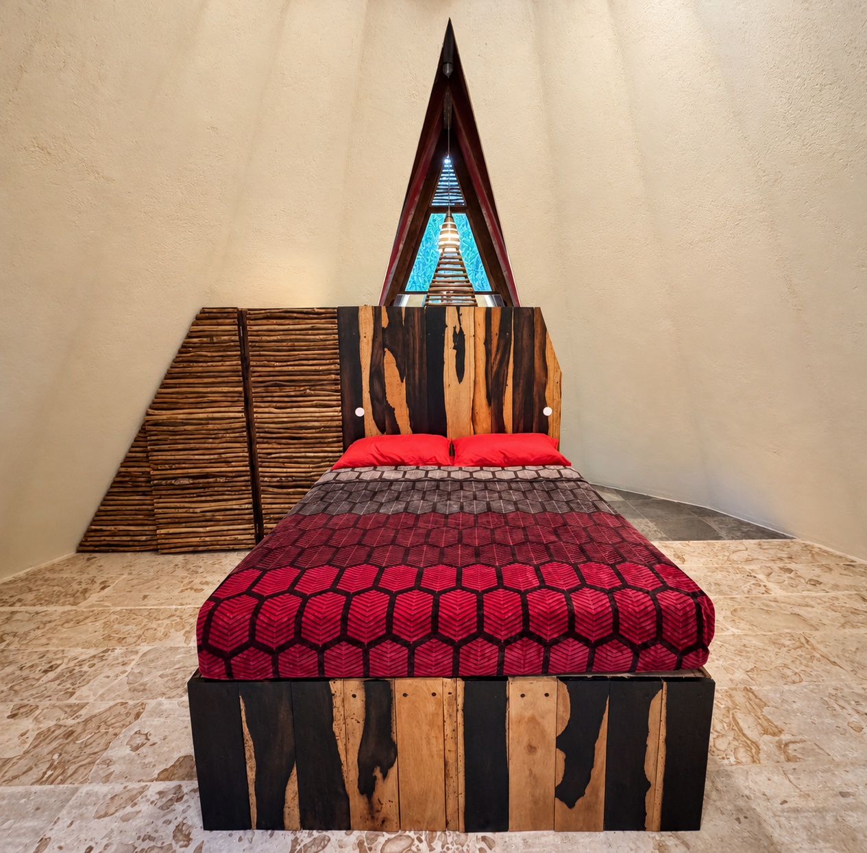 cone shaped studio with a thatched roof in the forest